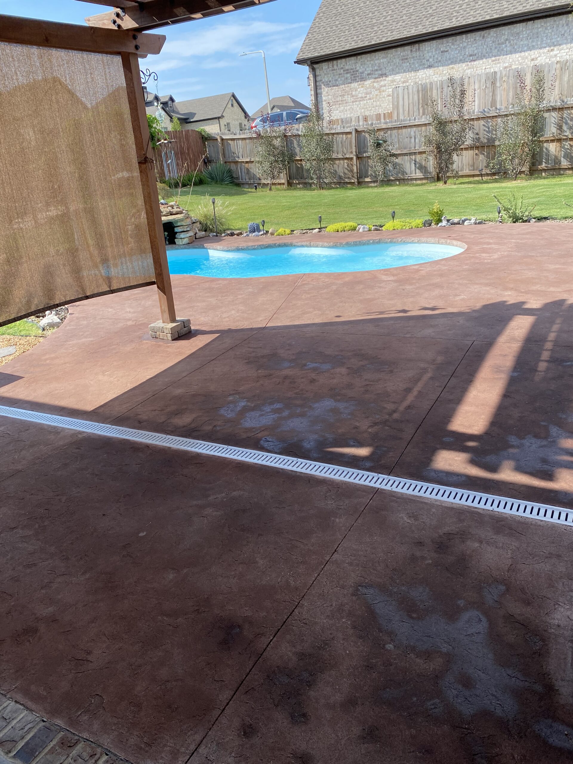 during-antiquing-aztec-brown-staining-pool-deck Concrete stain application