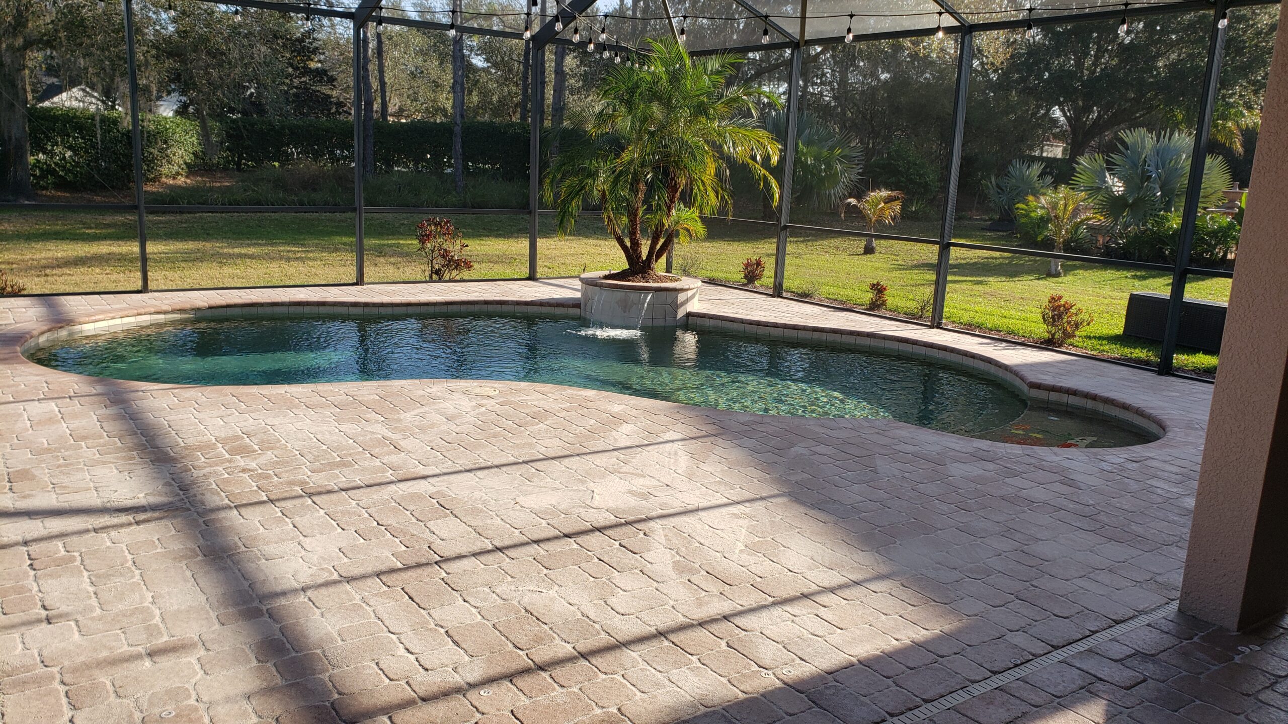 Unstained, worn-out pool deck before transformation