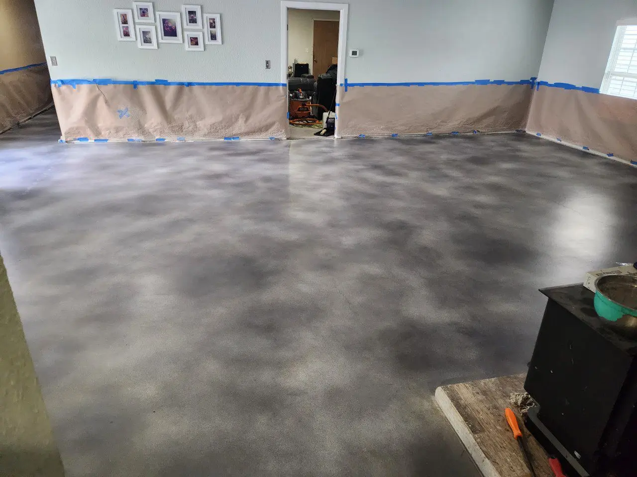 After Applying AcquaSeal Satin Sealer - Concrete floor with a protective coating of satin sealer, enhancing the vibrancy of the dye