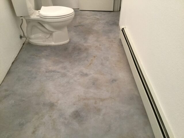 Dyed concrete bathroom floor