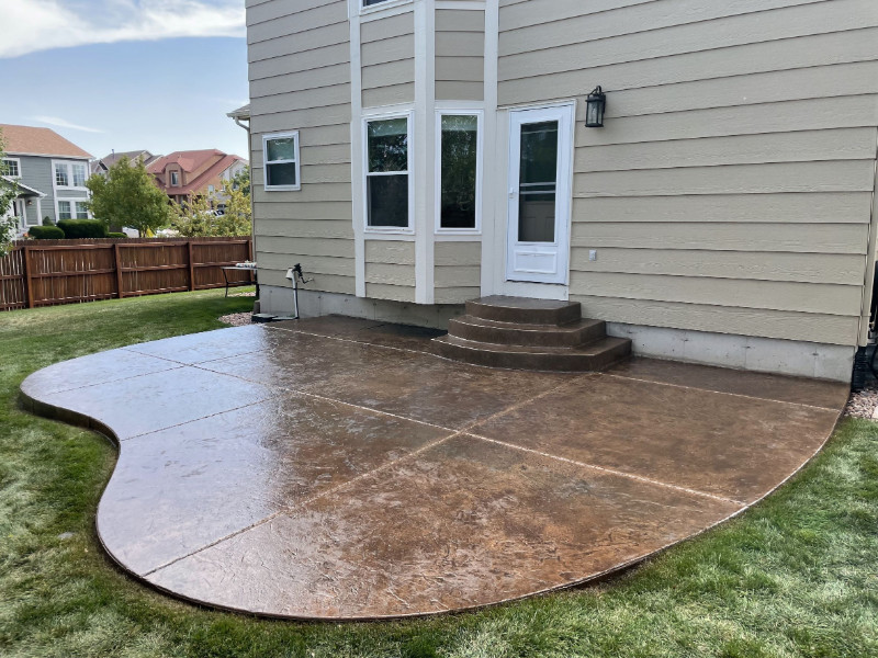 Recolored faded stamped concrete patio with Driftwood Antiquing stain