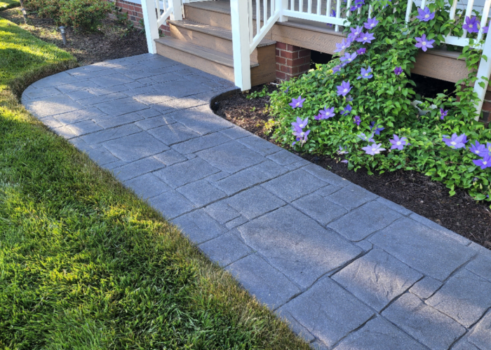 Freshly renovated sidewalk with charcoal antiquing stain and satin finish