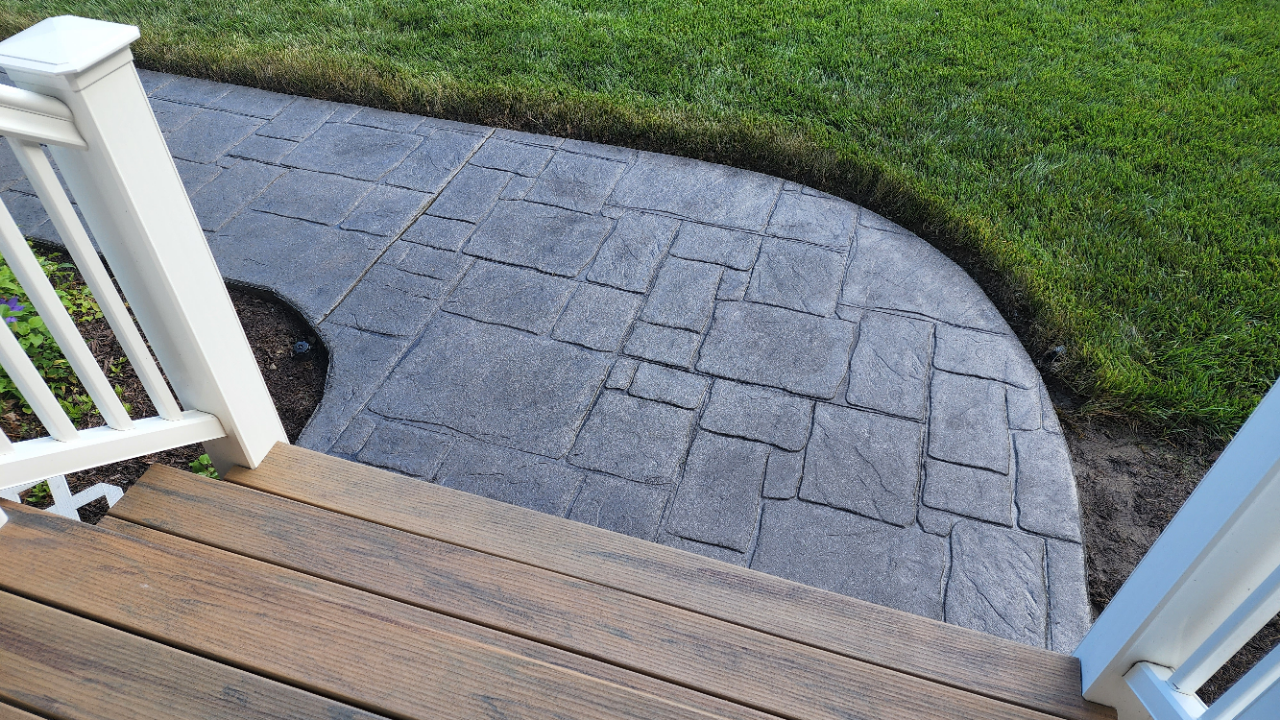 Close-up view of the revitalized sidewalk with charcoal antiquing stain and satin sealer