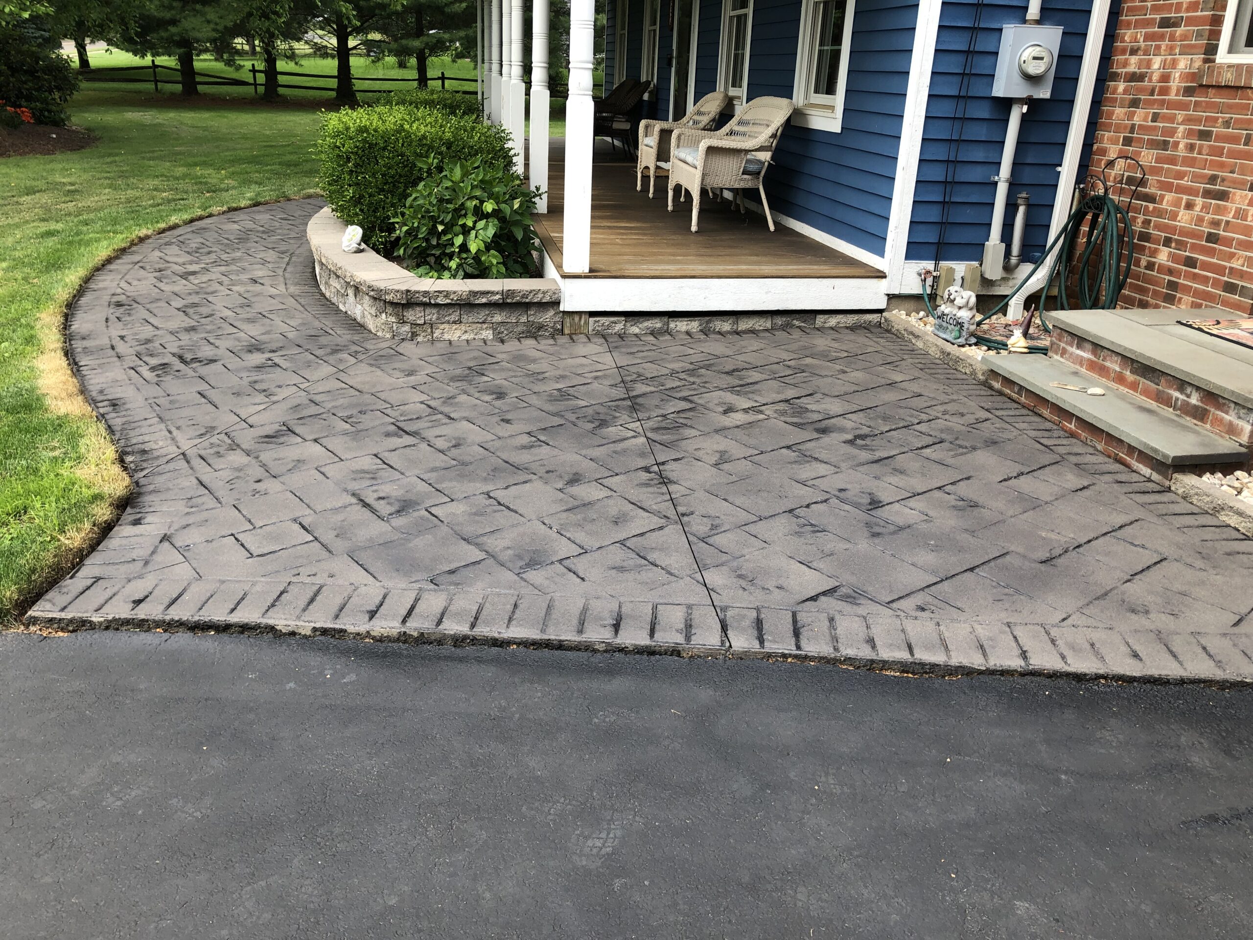 Charcoal & Light Charcoal Portico Stains on Stamped Concrete Walkway