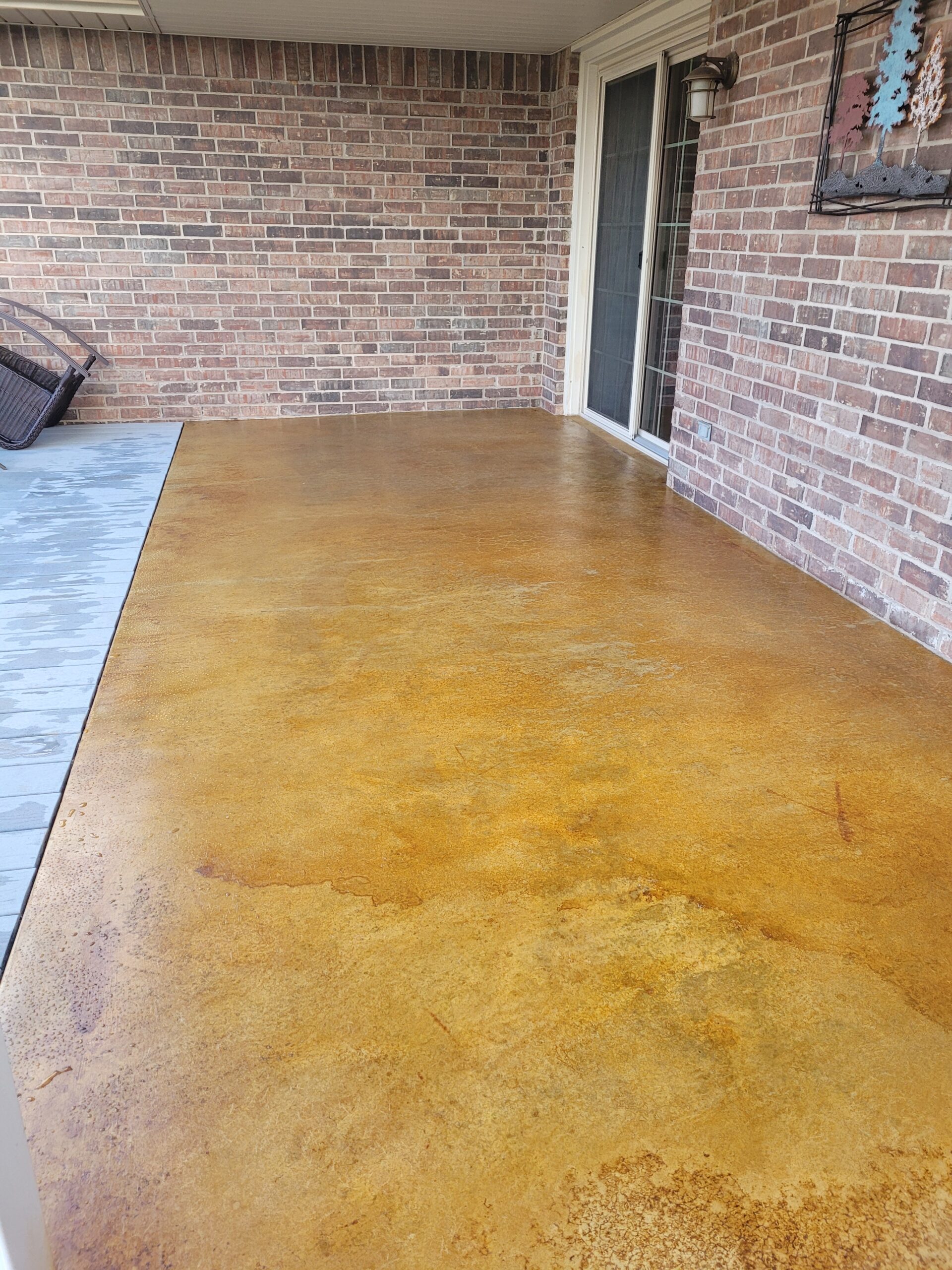 Stained concrete patio with ColorWave gold water-based stain