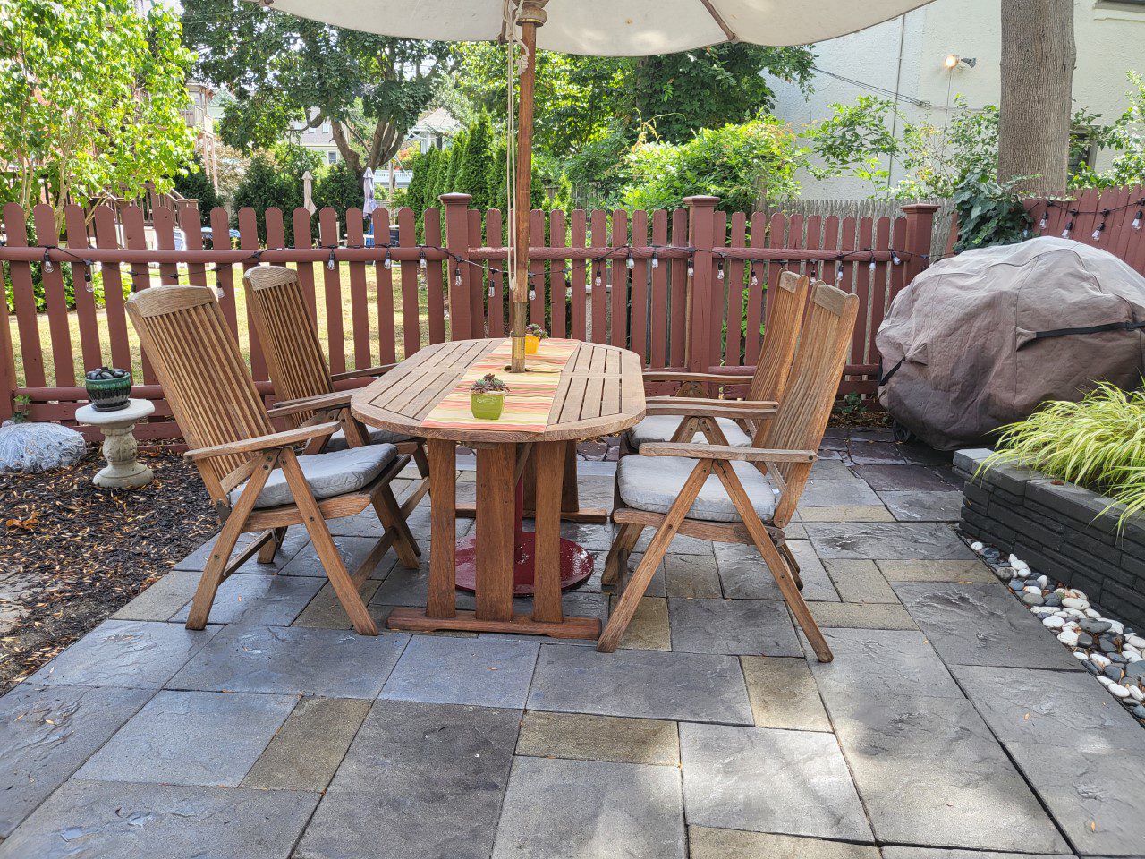Image revealing the slate-like stamped concrete patio after application and drying of three distinct Antiquing stain colors, emphasizing the transformed, vibrant appearance of the surface