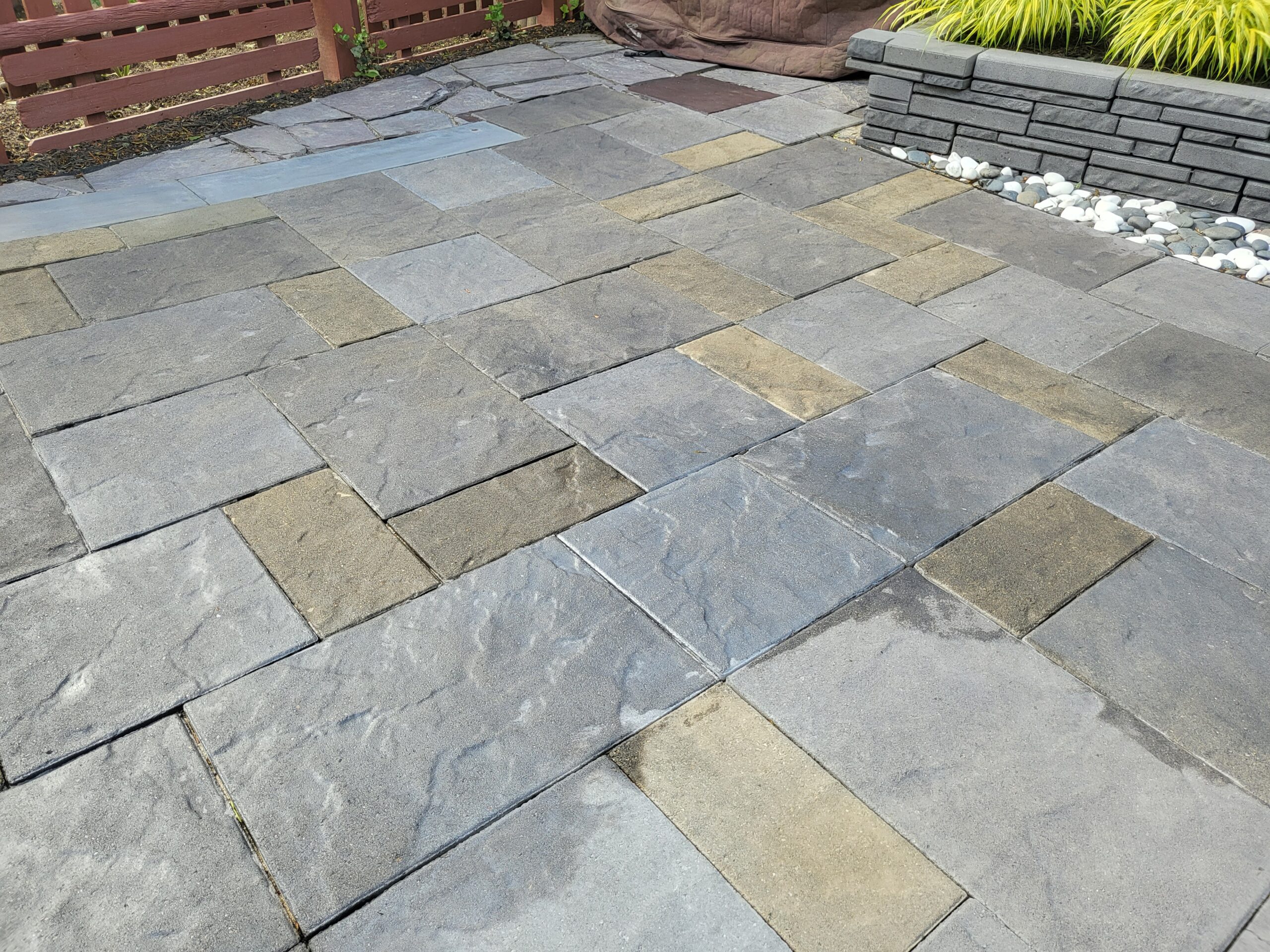EasySeal drying highlighting the intricate texture and rich combination of Silver Gray, Light Charcoal, and Tweed Antiquing stains on the slate-stamped concrete patio, revealing the stunning transformation and depth of colors