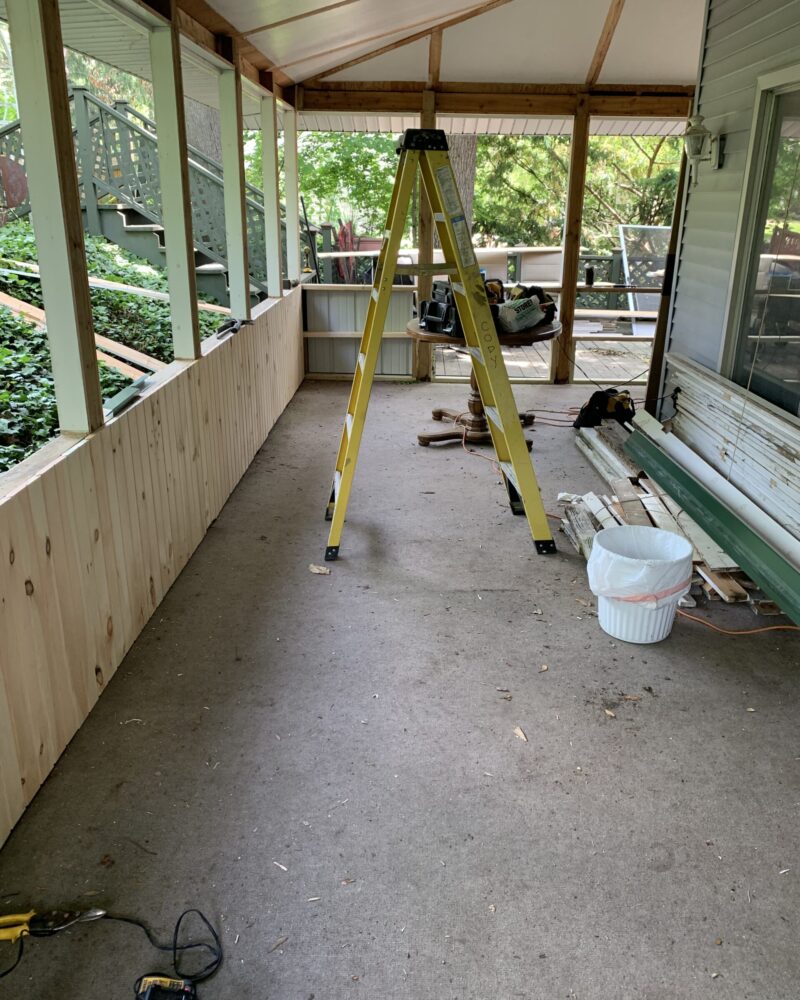 Old carpeted porch before the transformation process