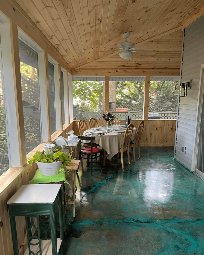 Sunroom concrete floor stained with Azure Blue, English Red, and Seagrass EverStain acid stains, then accented with acrylic paints