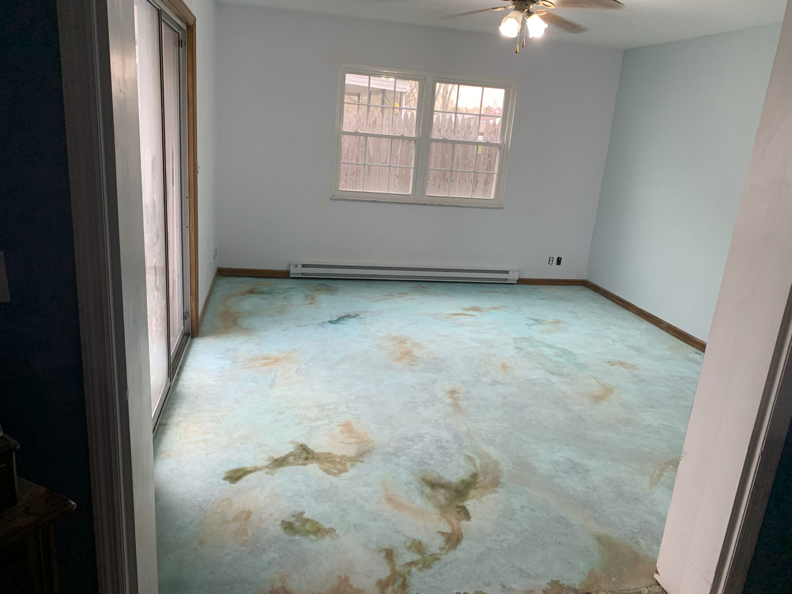 Concrete floor after Azure Blue and Shifting Sand stain application, prior to neutralization