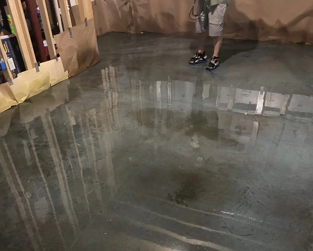 Application of Azure Blue acid stain on a concrete floor