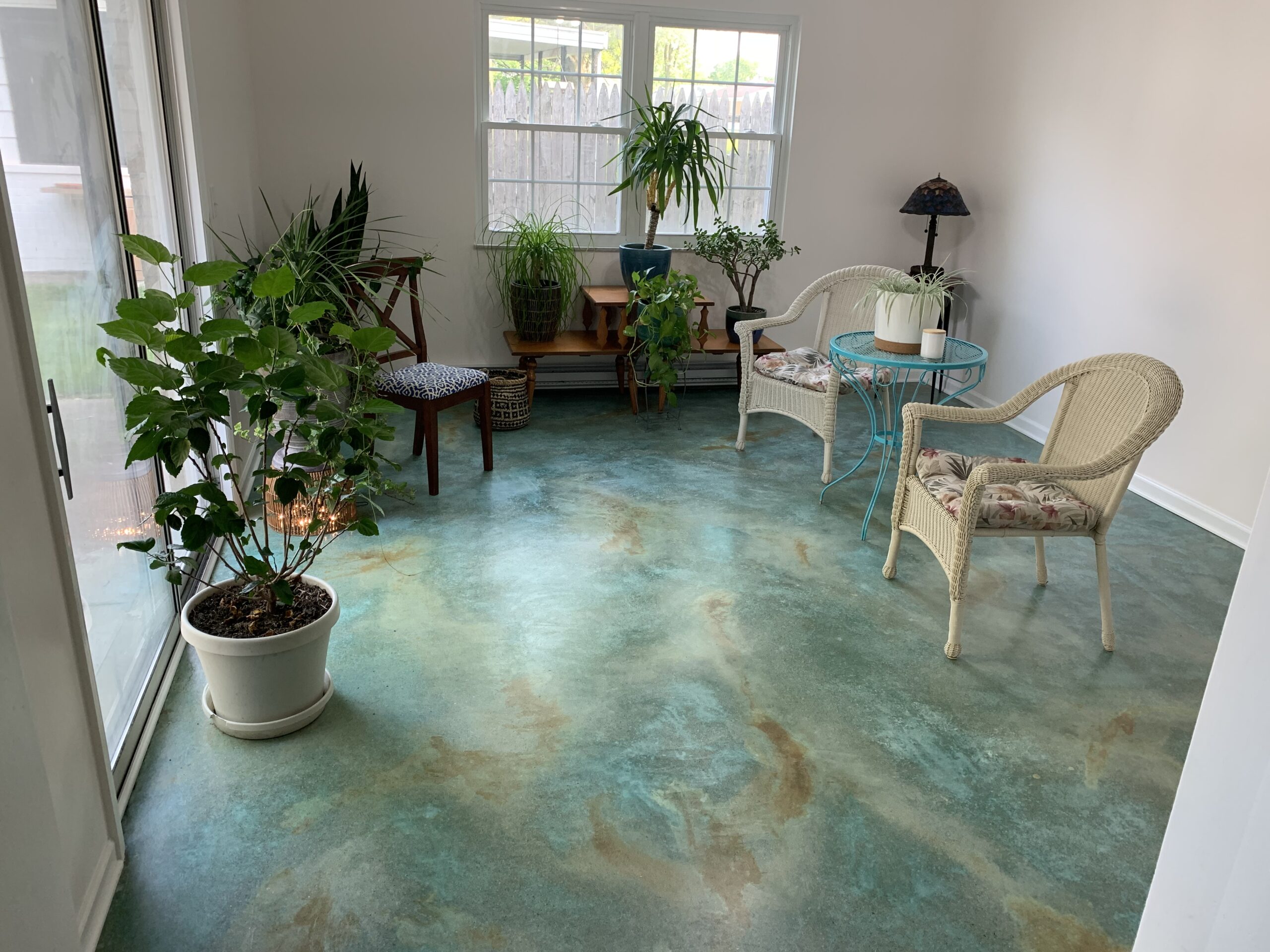 Finished stained concrete floor furnished, revealing the completed project