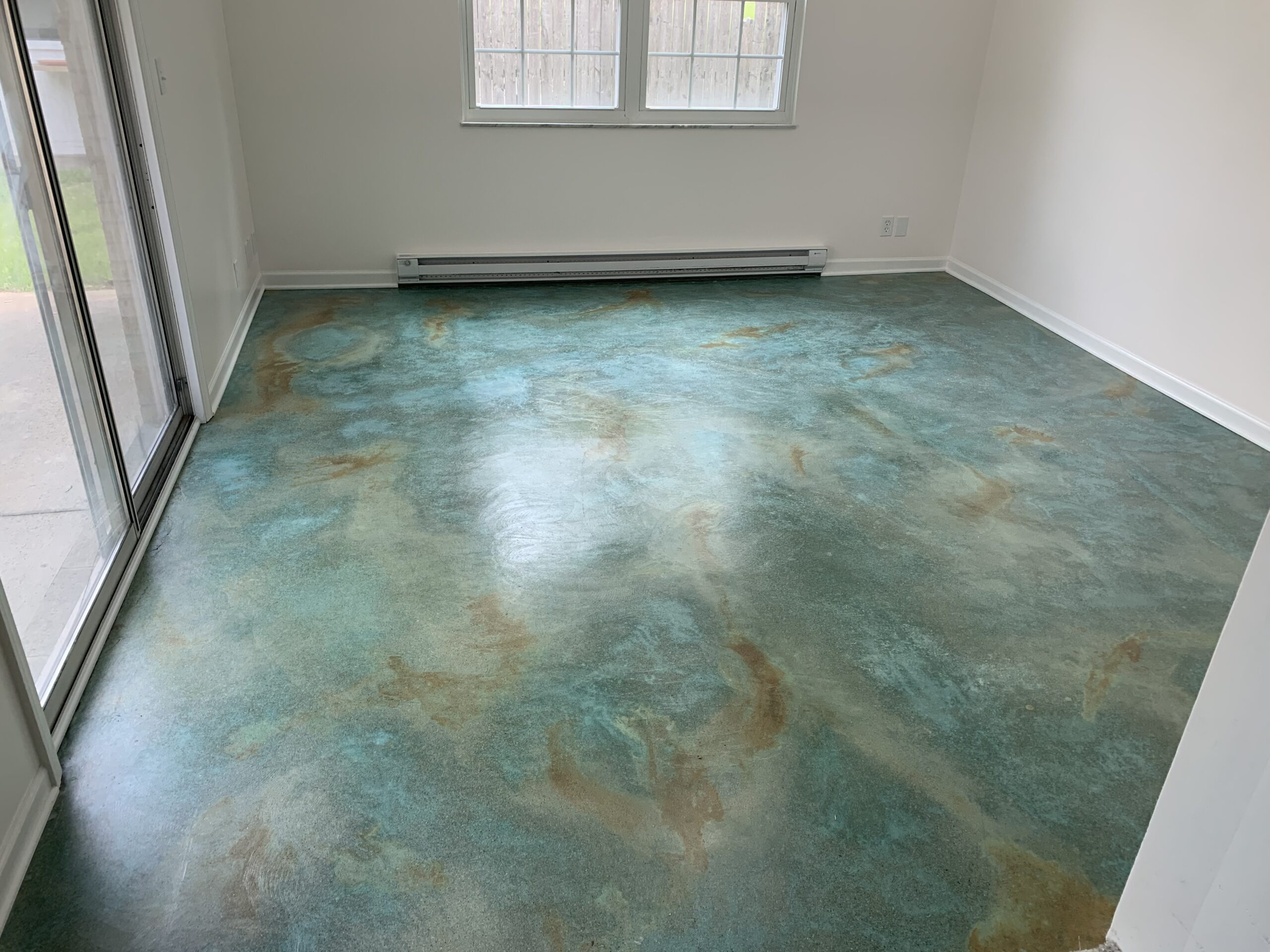 Concrete floor after application of two coats of AcquaSeal Gloss, showcasing a polished finish
