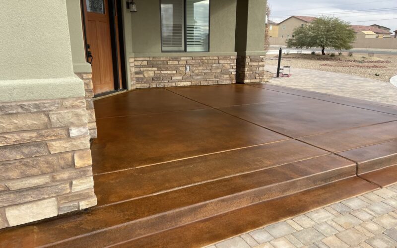 Front porch concrete brought to life with the deep hues of English Red and Coffee Brown