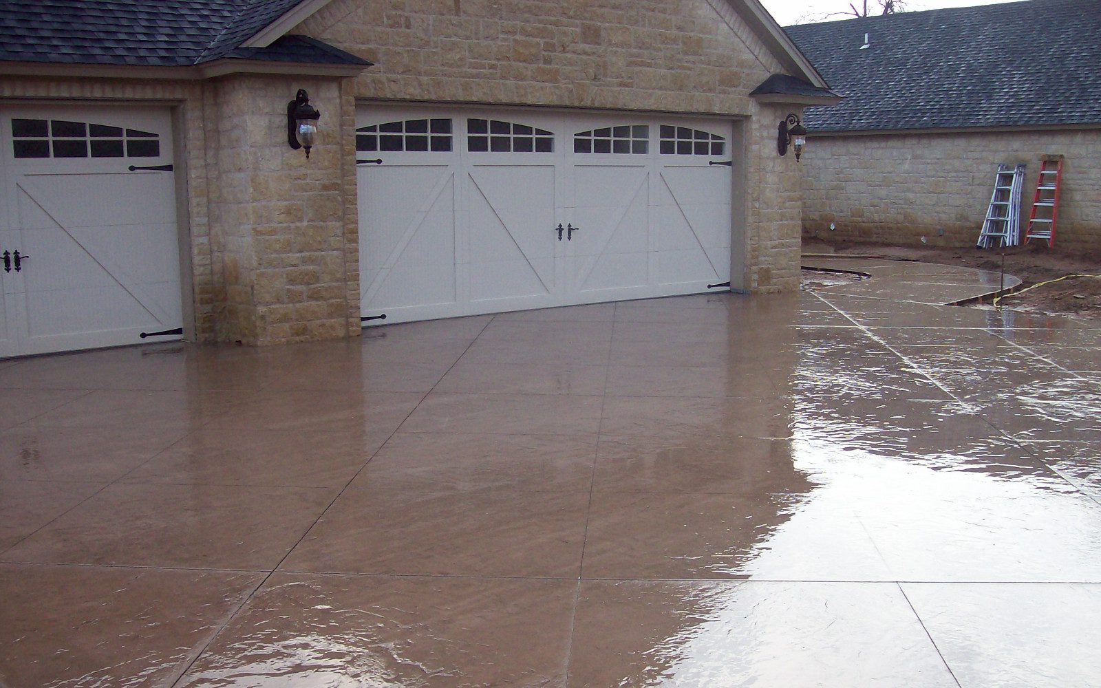 Scored concrete driveway stained with sunset tan EasyTint gloss