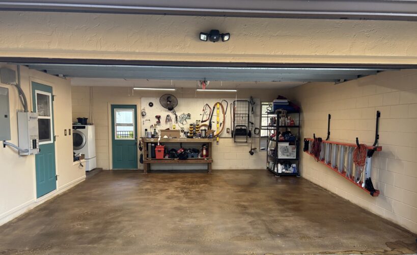 The newly sealed garage floor with an open door for ventilation due to strong VOCs, followed by the successful test of parking cars without peeling or hot tire marks after the coating has cured