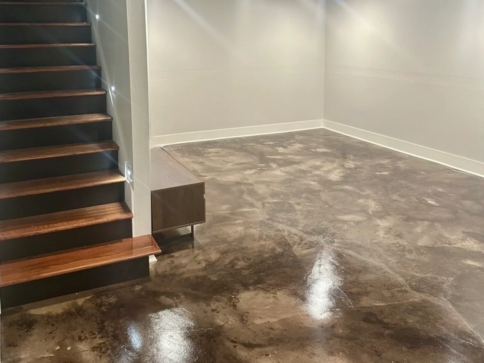 black EverStain acid stained concrete basement floor