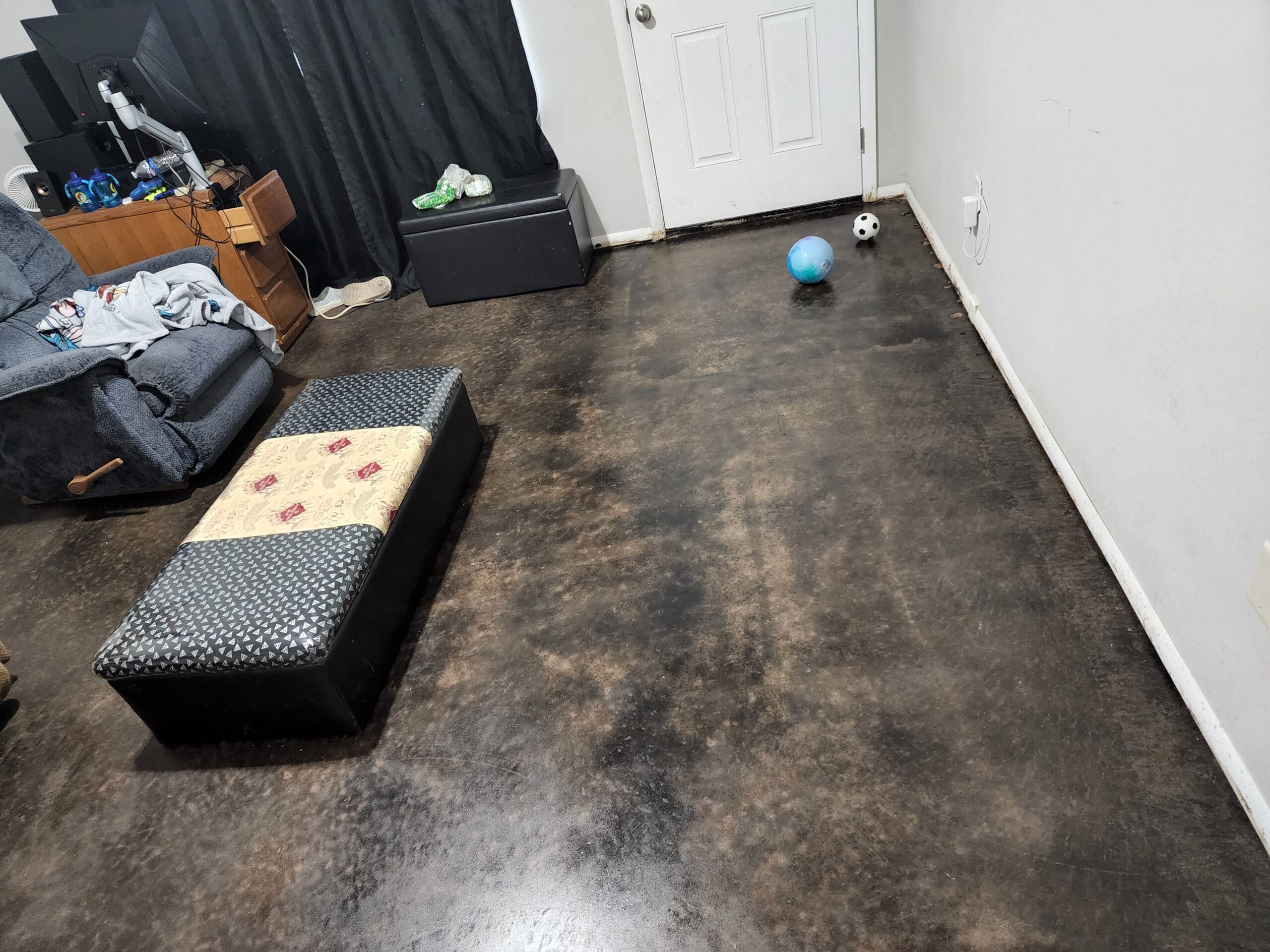 EverStain black acid stained concrete floor after carpet removal