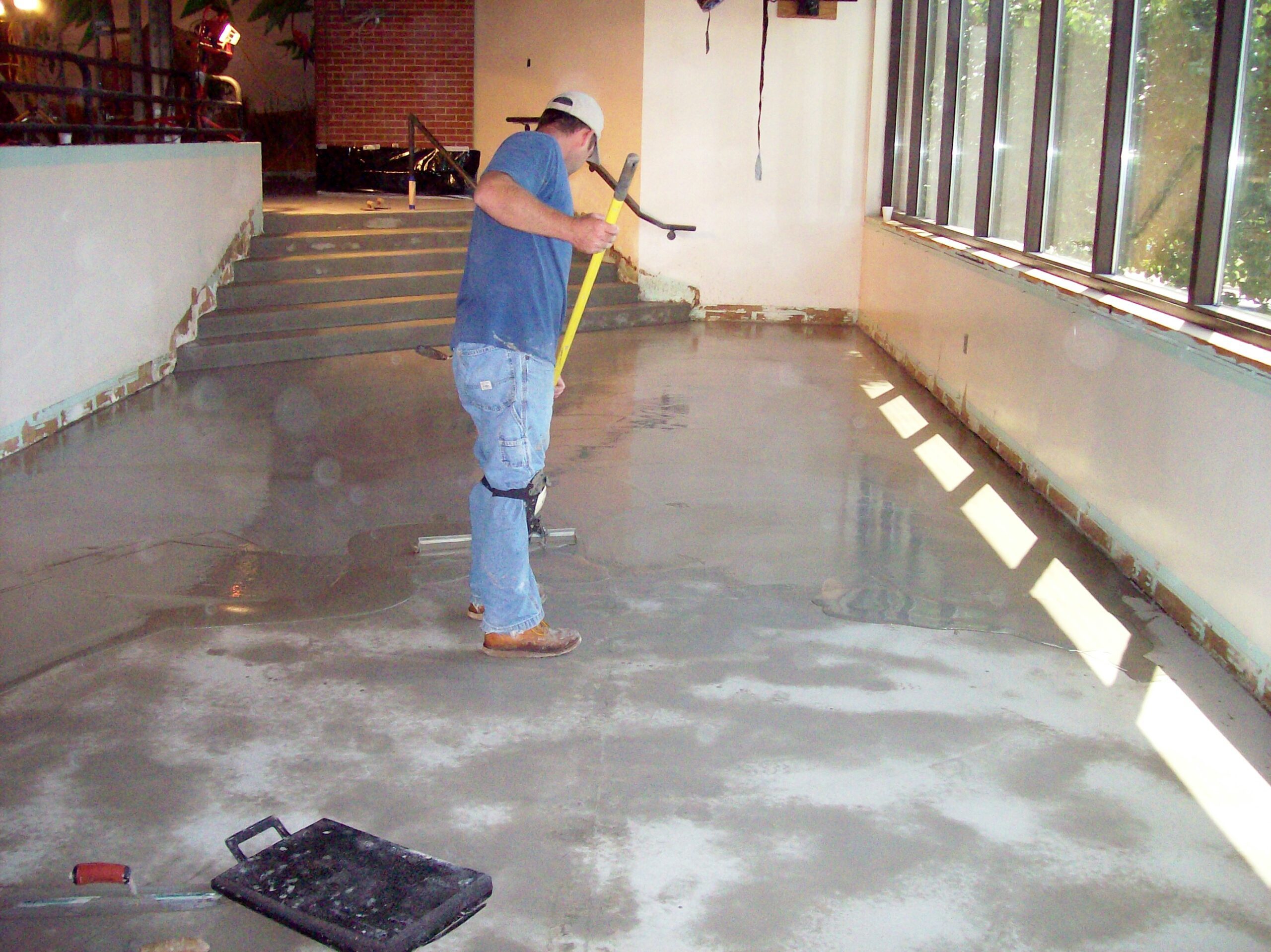 Resurfacing floors with concrete overlay
