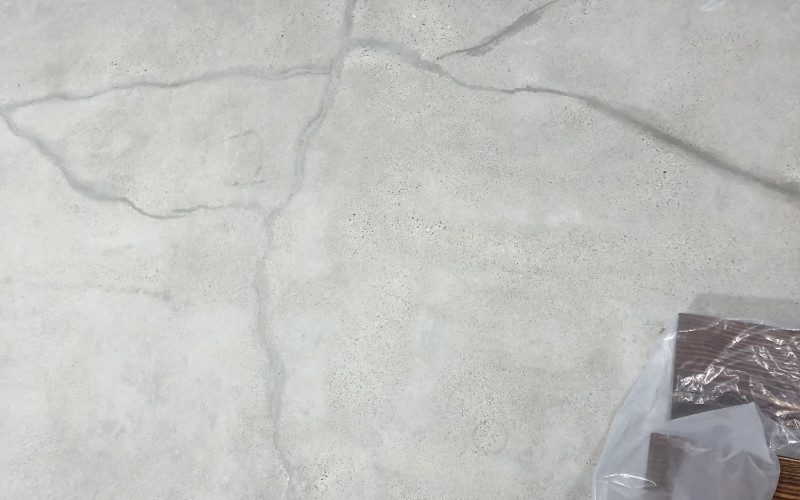 Small hairline cracks being filled with cement mix