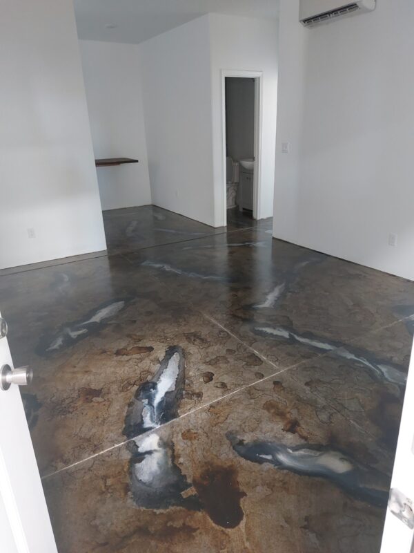 Residential floor stained with Colorwave water-based stain, showing white streaks with stone grey filled in with steel grey, sealed with gloss acquaseal