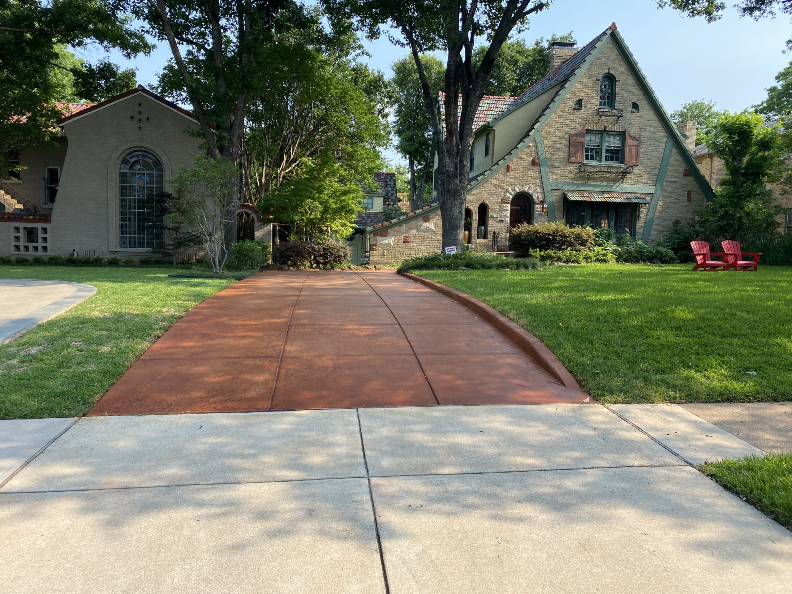 Tangerine ColorWave water-based stain on scored concrete driveway