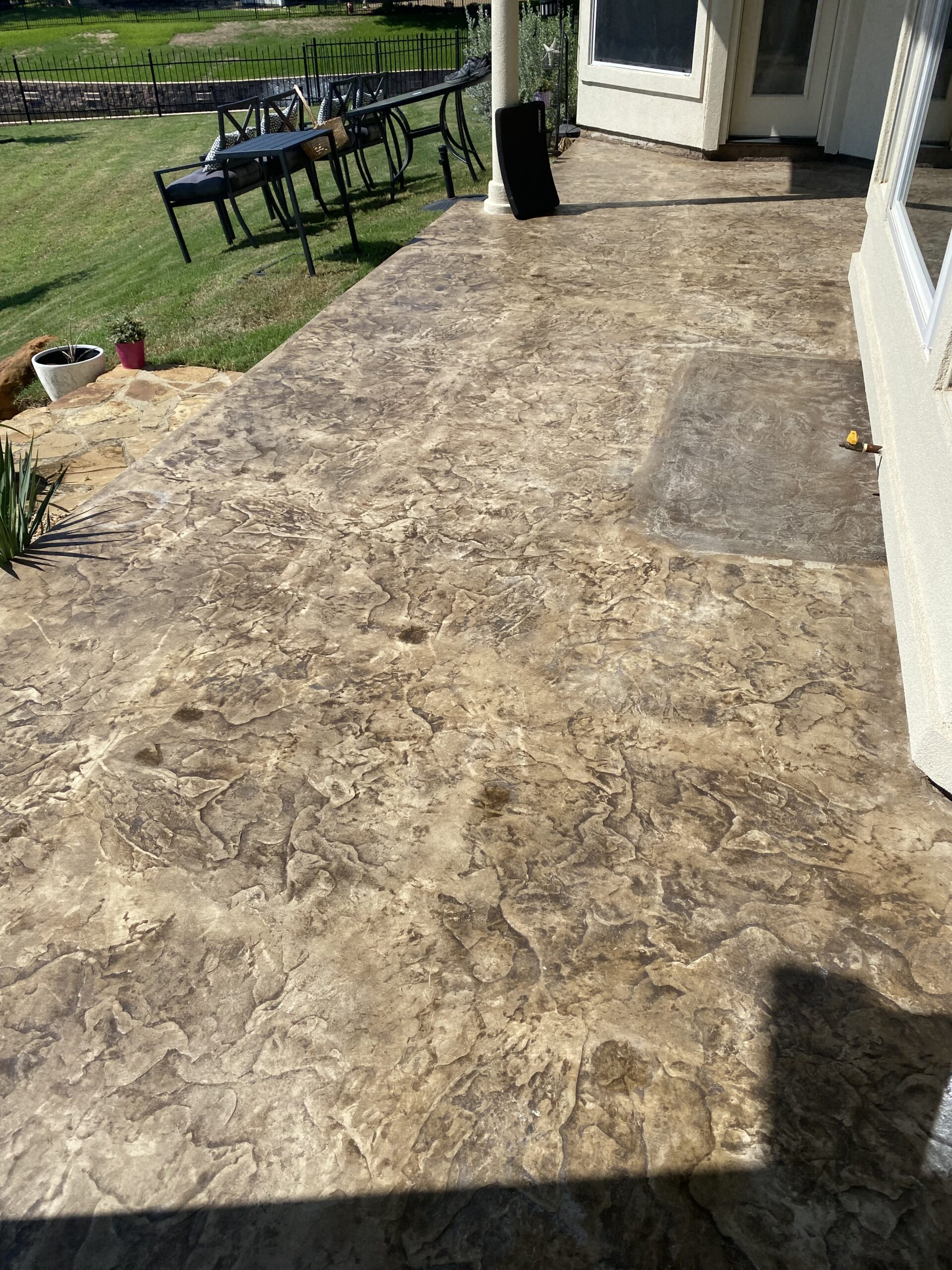 Old scratched and cracked concrete patio