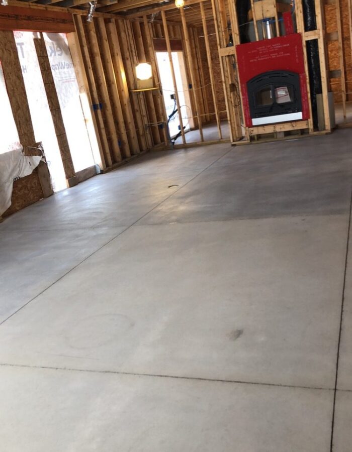 Half of Room Stained with White ColorWave on Concrete Floor