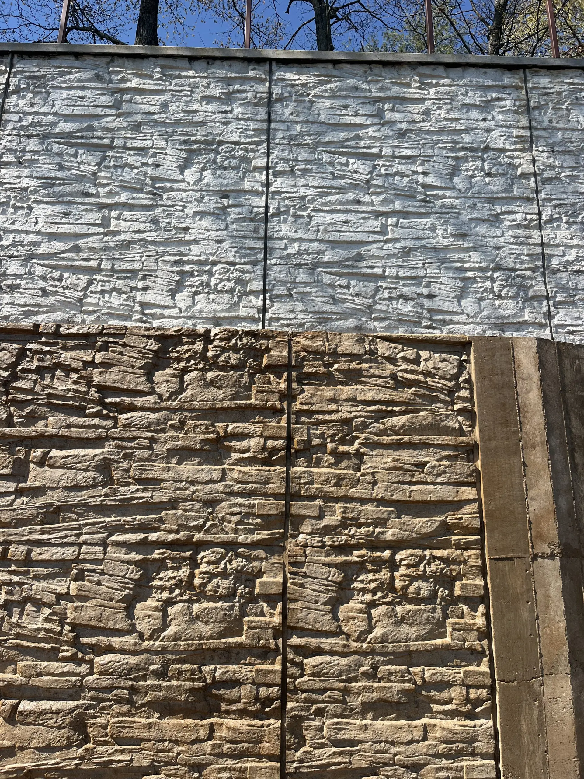 Contrast shown during Cafe Royale EasyTint staining on a concrete retaining wall