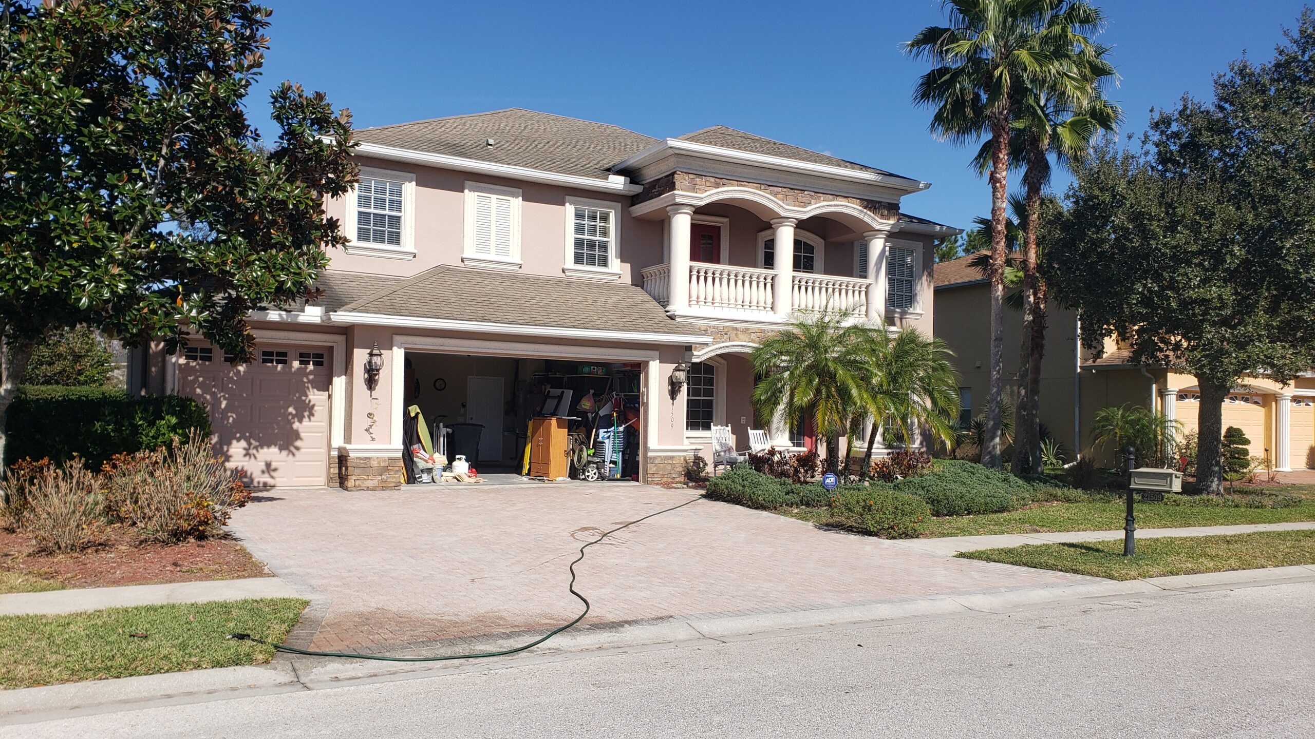 Before photo of a drab driveway