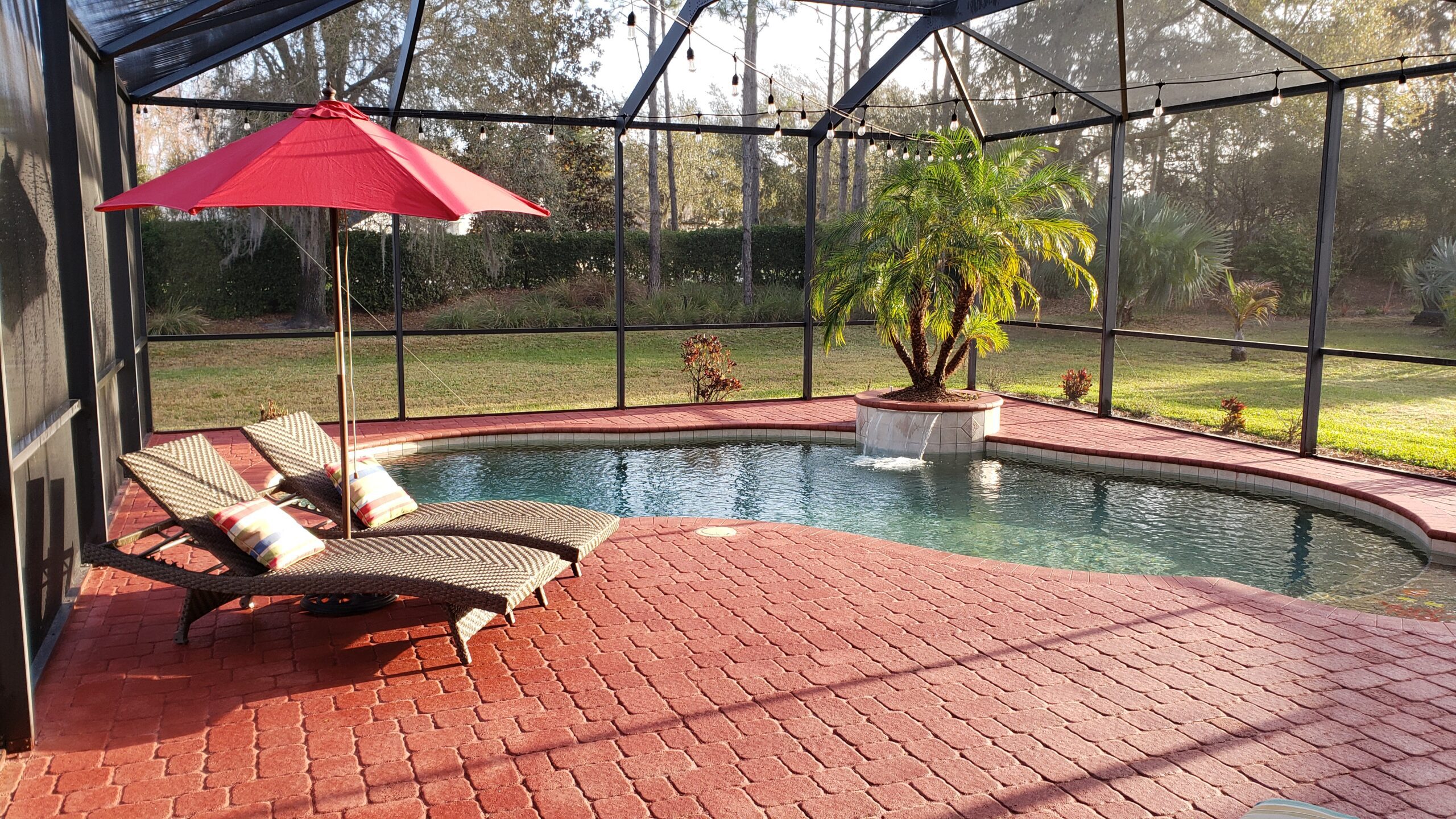 Pool deck made of stained pavers with a rich and vibrant Milano Red EasyTint finish