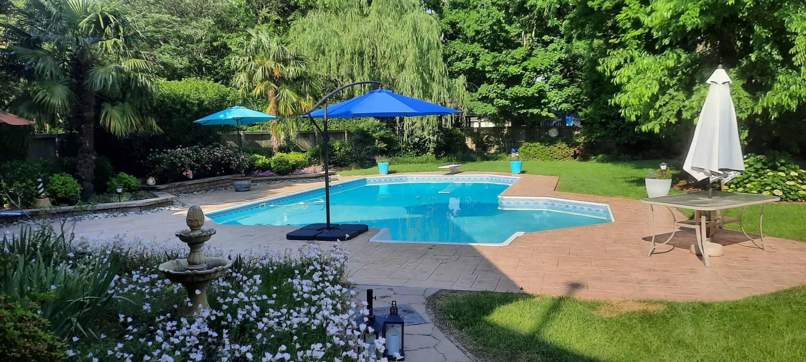 Stamped concrete pool deck restored with Tan Antiquing stain.