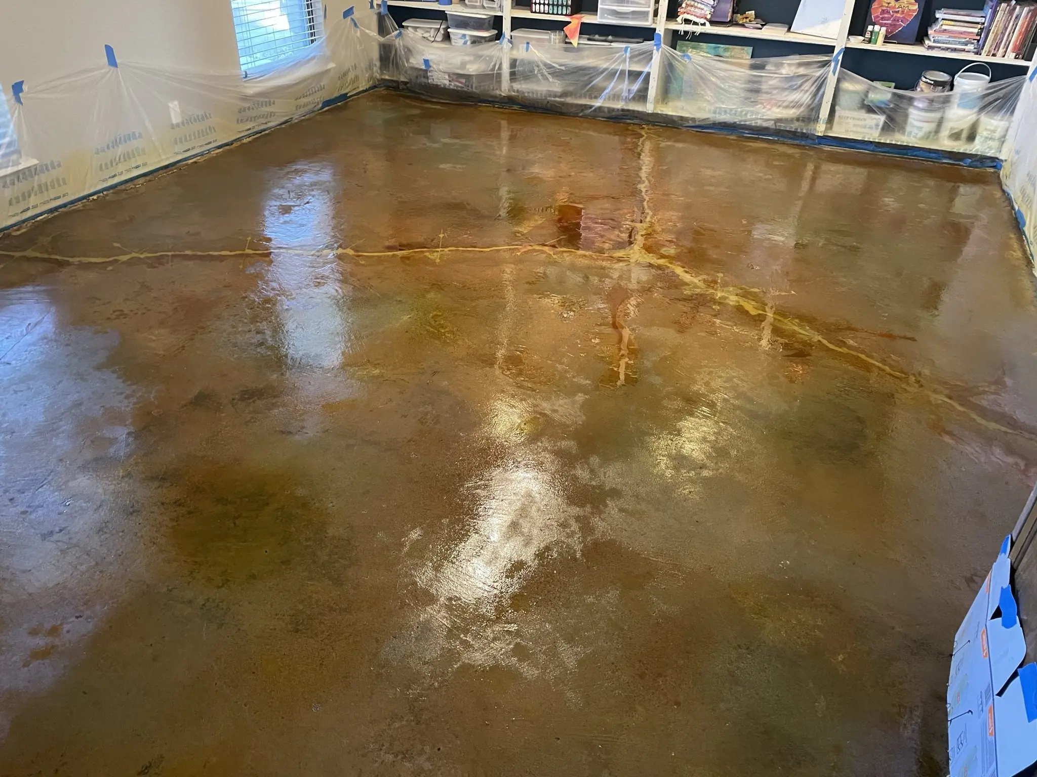 A photo capturing the moment of the wet acid stain application.