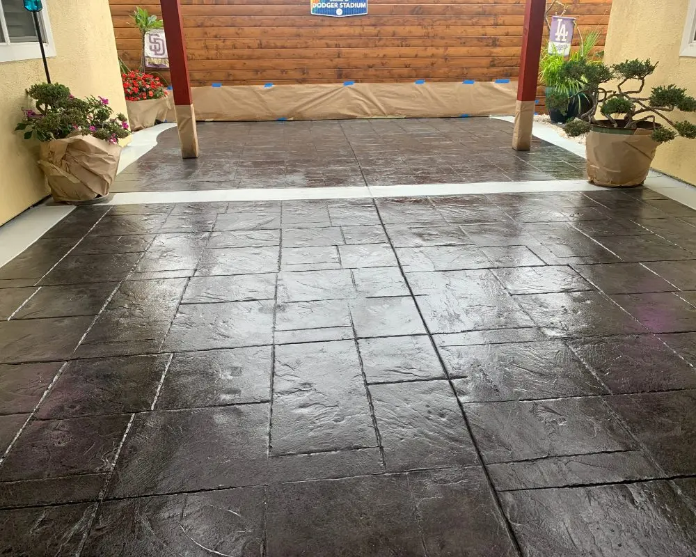 Revitalized courtyard with charcoal antiquing stain and gloss sealer