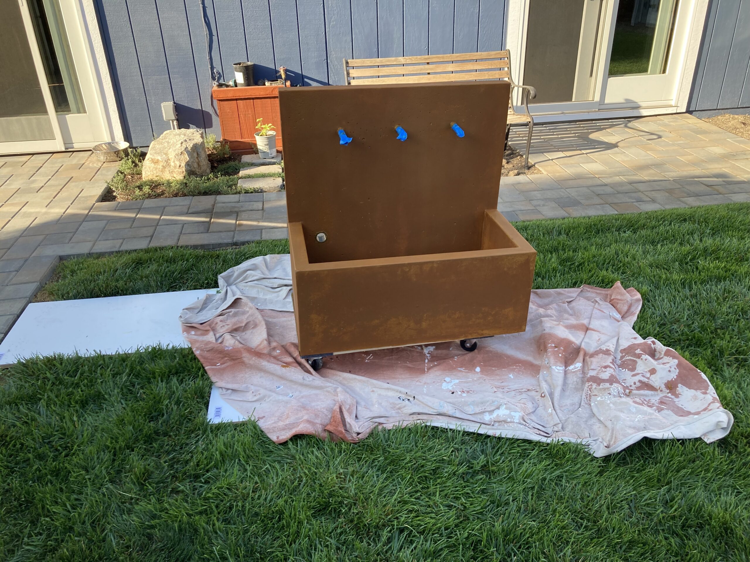 The concrete fountain immediately after the application of the Coffee Brown DecoGel stain.