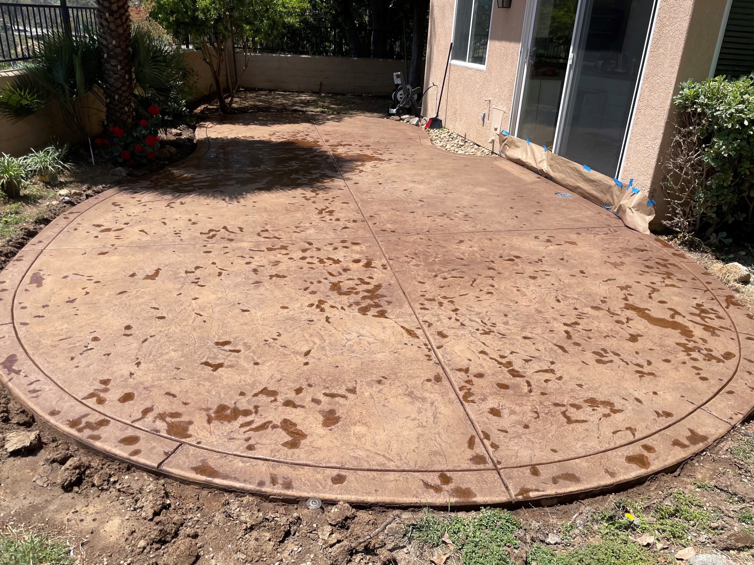 Backyard patio displaying fresh Driftwood Antiquing Stain, pre-sealer application