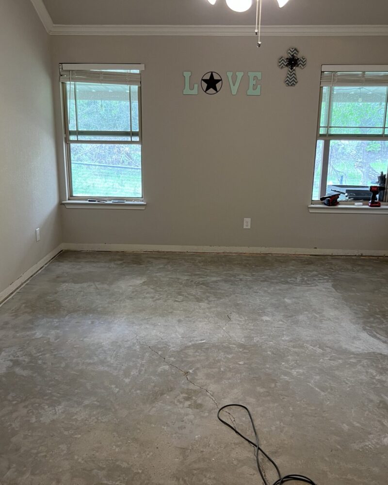 Image of a room with bare concrete floor, prior to acid staining.