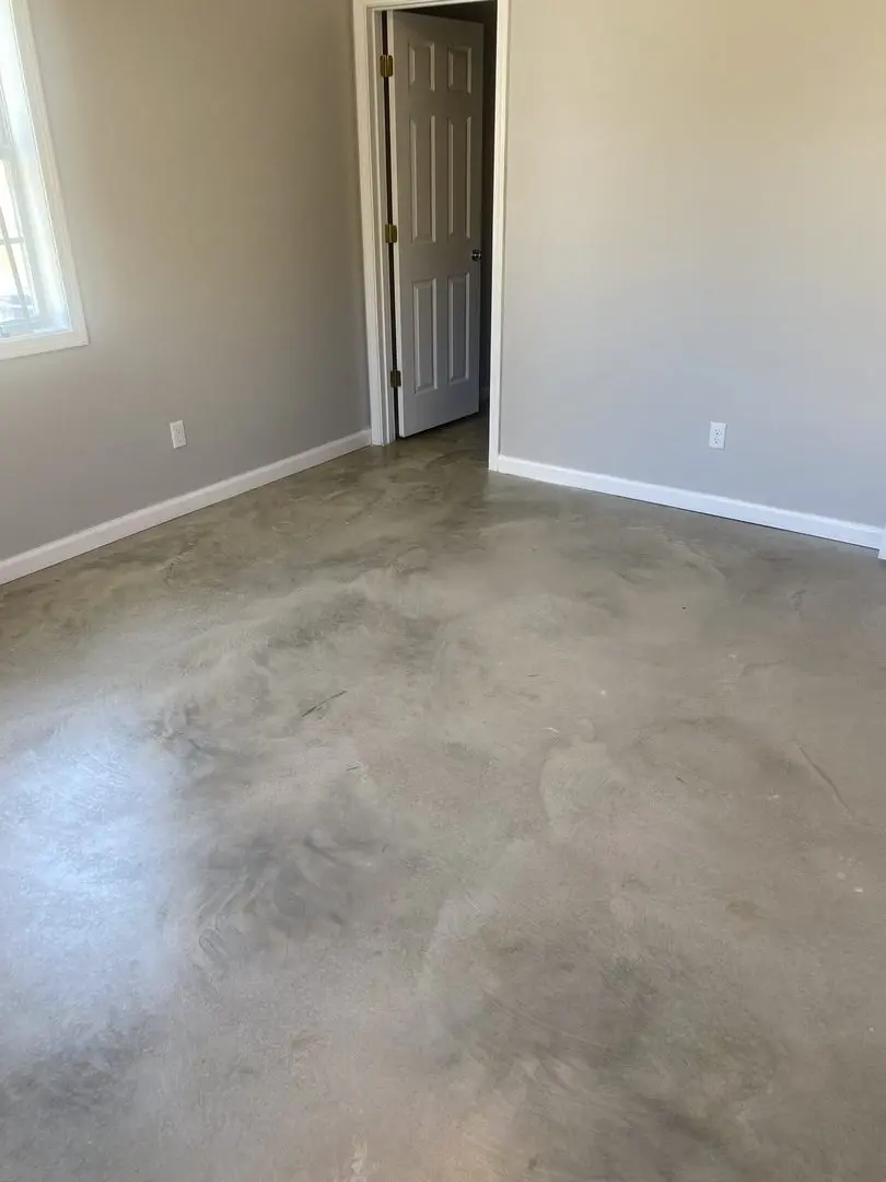 Bare concrete floor before staining