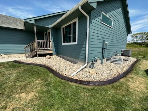 After photo of stamped concrete curbing restained with Charcoal EasyTint™ by DCPro Denny Woolheater with Concrete Contours.
