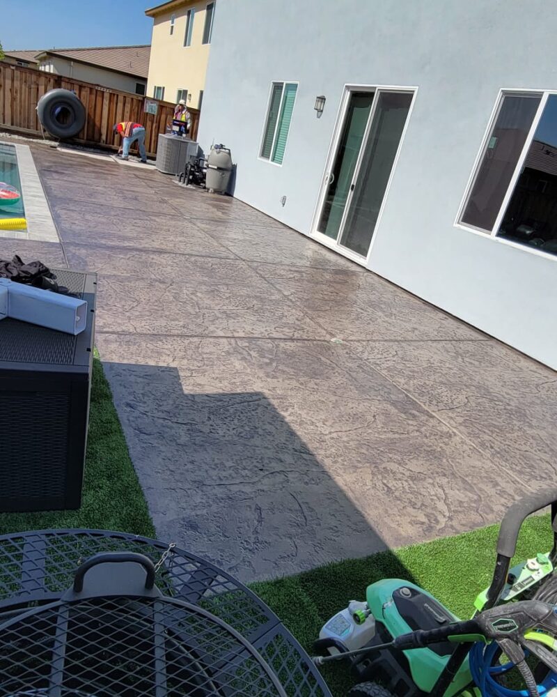 Stamped concrete patio deck after application of Light Charcoal EasyTint™ Gloss