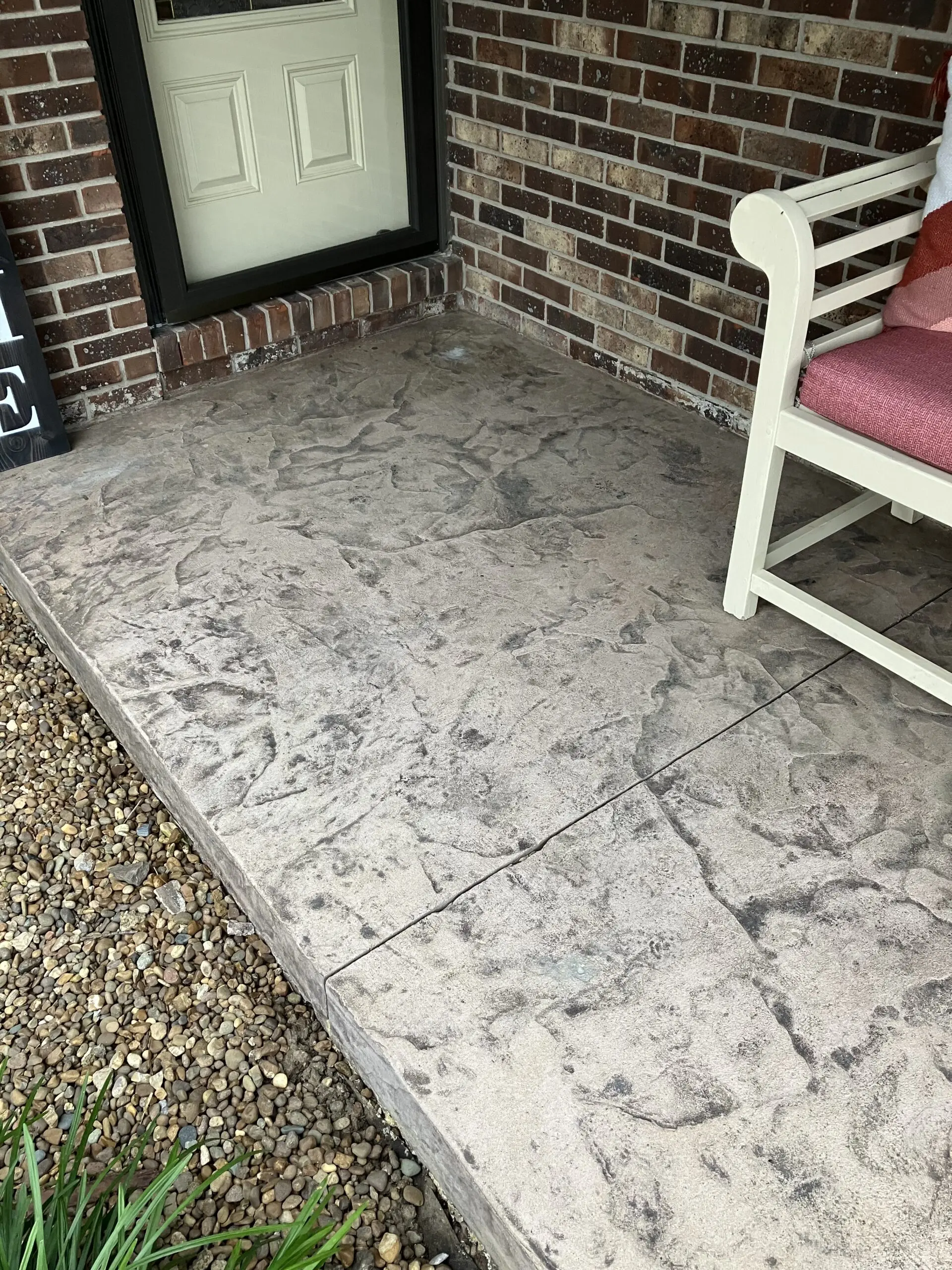 Unstained, faded porch slab prior to restoration