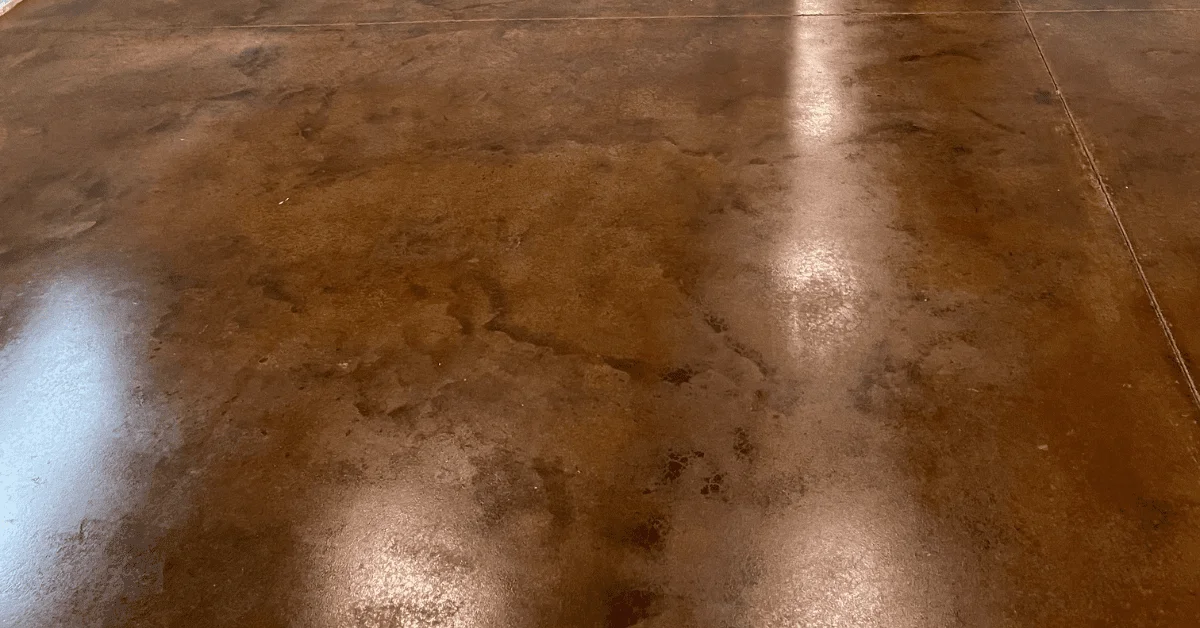 cola-colored acid-stained concrete flooring extending