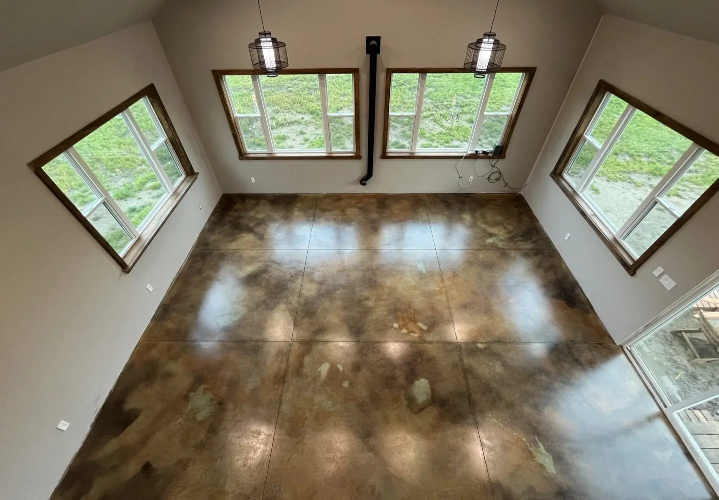 This concrete floor was stained using a layered acid staining technique with EverStain Black, Malayan Buff, and Seagrass