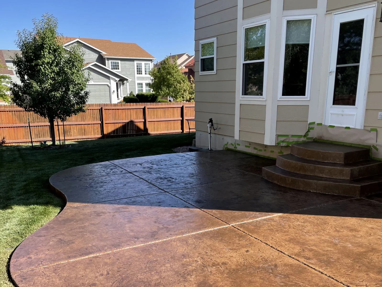 Resurfaced faded stamped-concrete patio