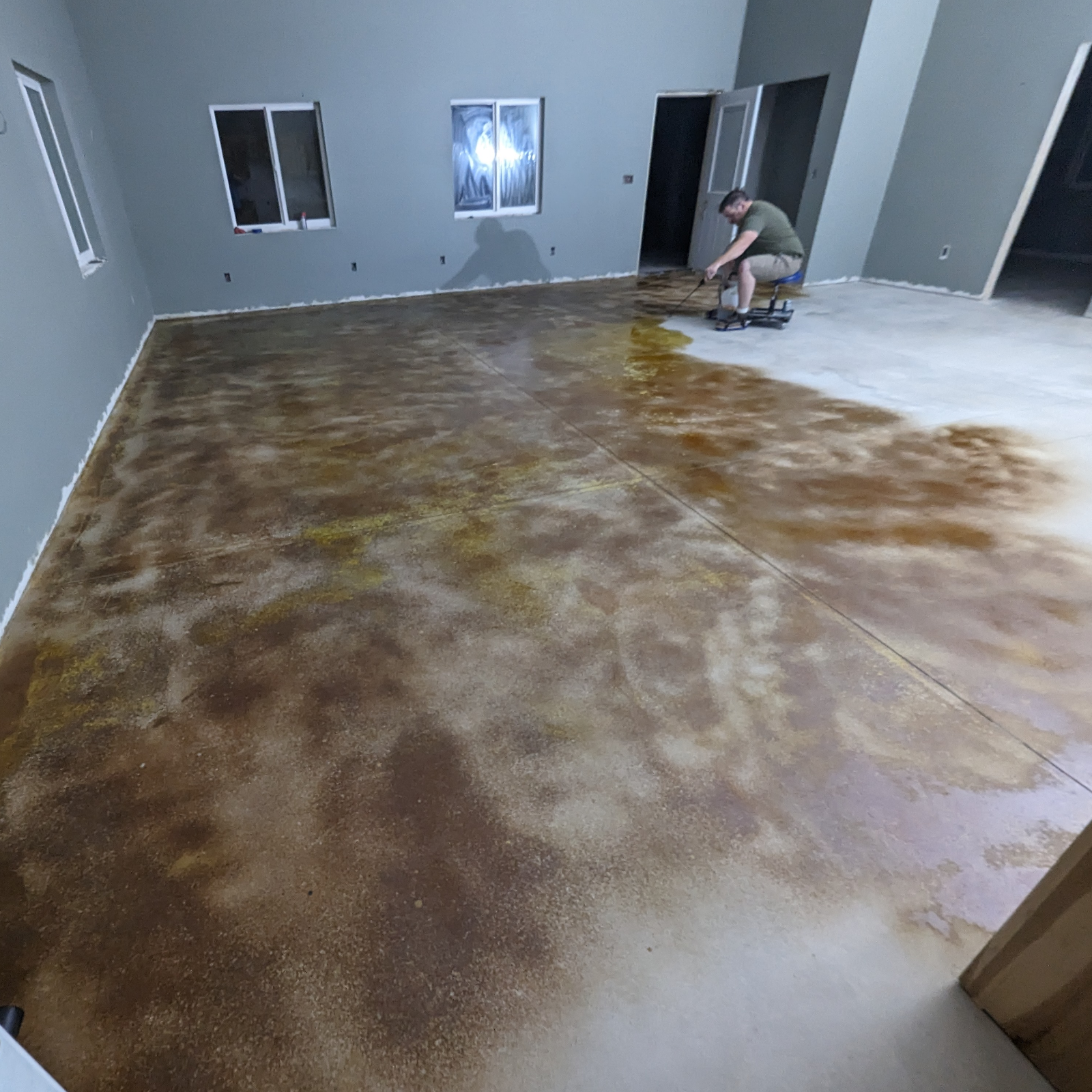 Application of EverStain™ Coffee Brown on shed house concrete floor, mid-process