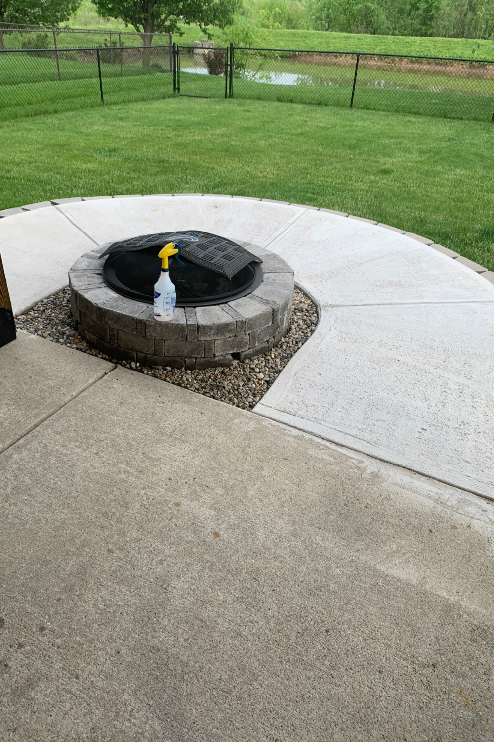 Initial view of the patio before staining, showing new concrete next to 25-year-old concrete