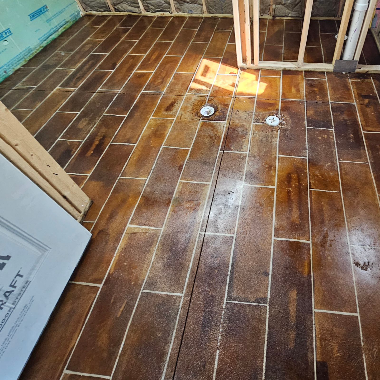 Final look of the faux-tile floor after applying two layers of sealer