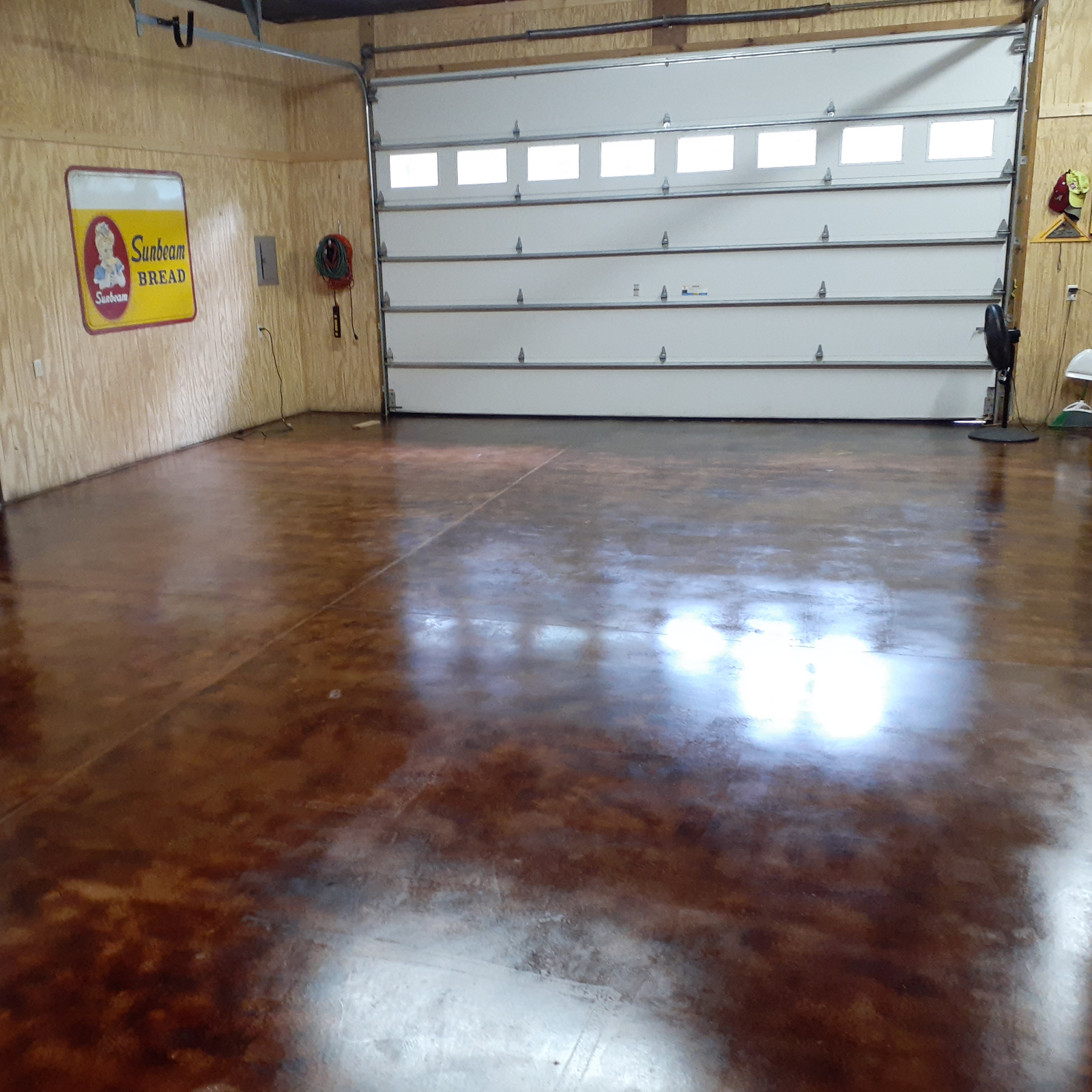 Finished Coffee Brown acid stained concrete floor in garage after second EasySeal coat