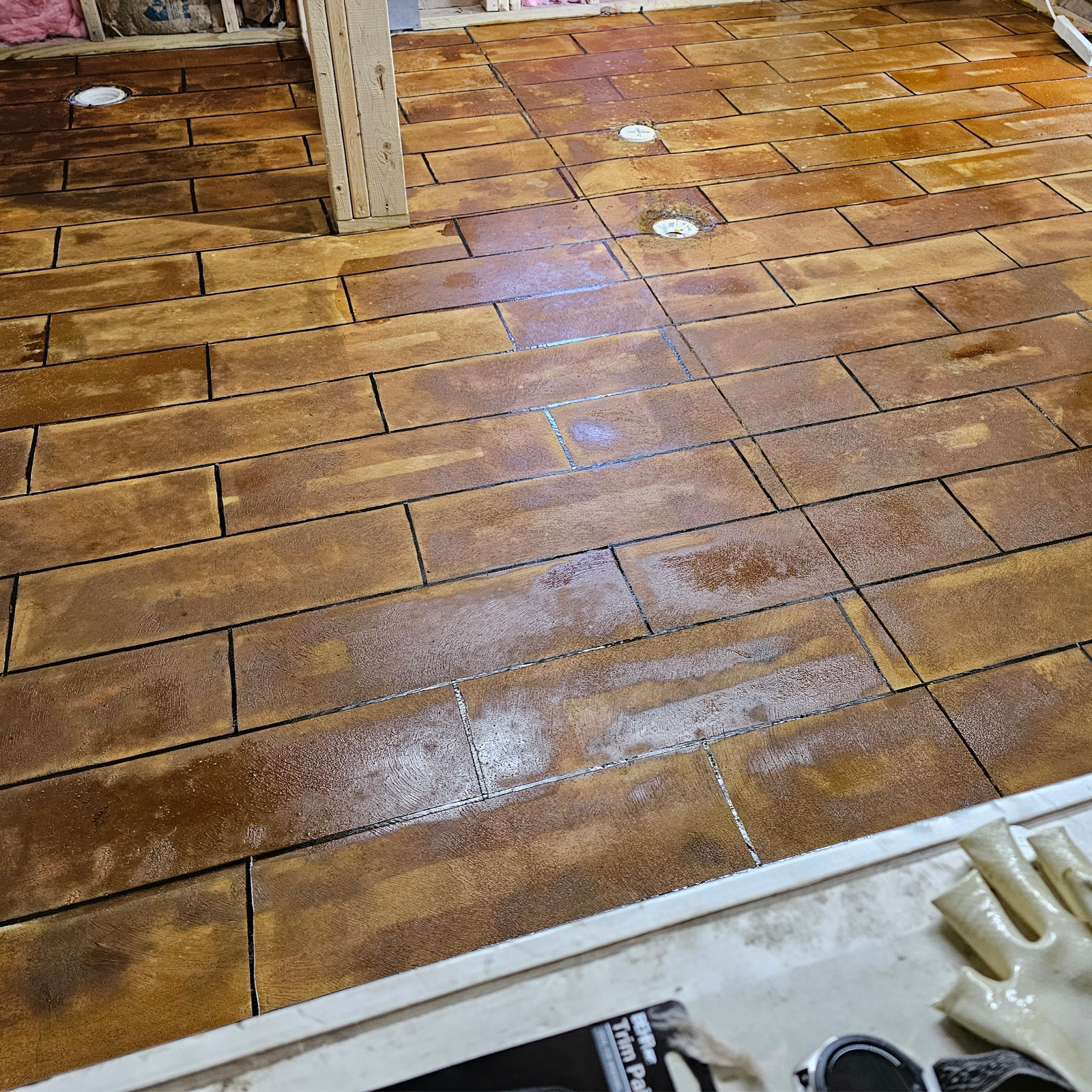 Freshly stained concrete floor in tile design, awaiting to dry