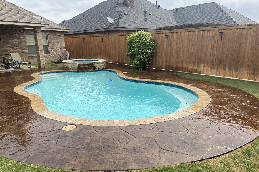 Refreshed stamped concrete pool deck with a Coffee Brown stain